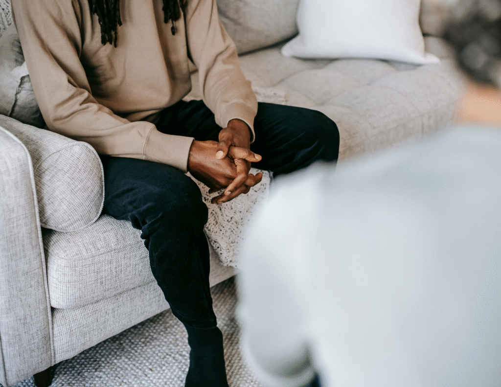 Man on couch talking to therapist