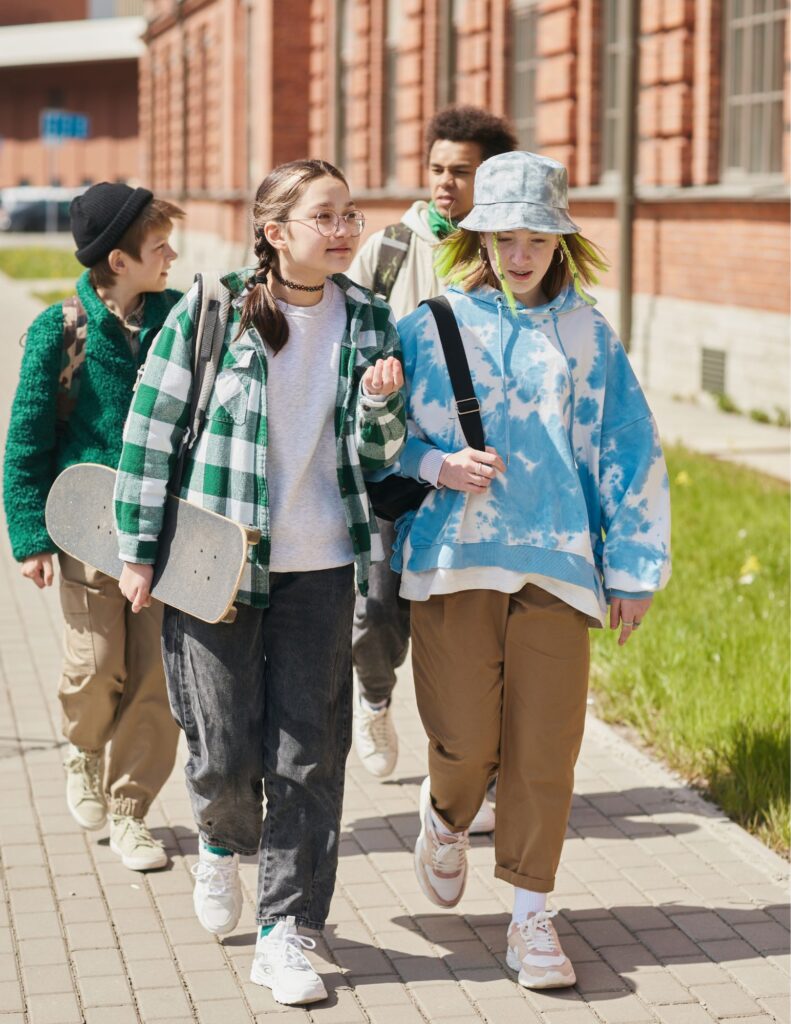 Kids walking on a sidewalk